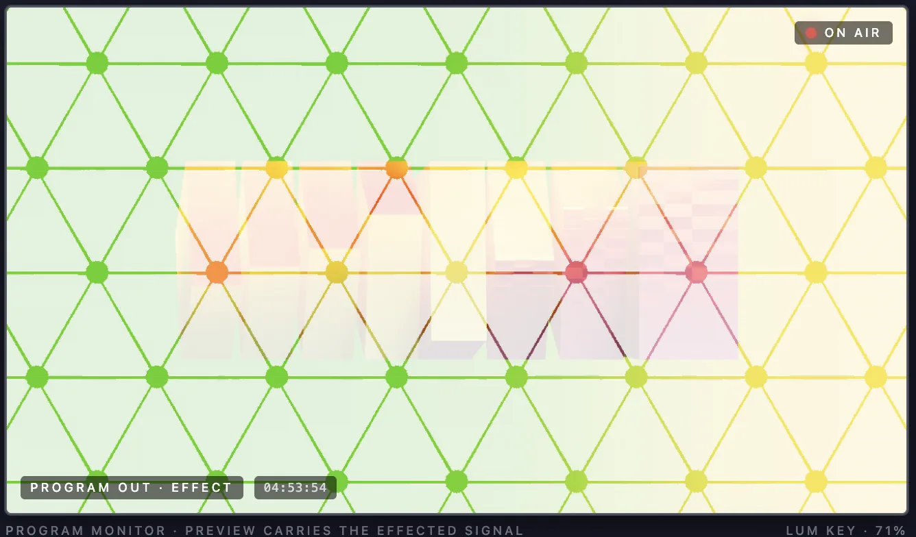 web-mx-50 program monitor, on air, showing a luminance-keyed title over a colored triangular grid pattern